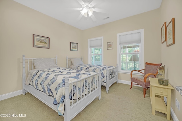 3878 White Blossom Cir, Southport, NC 28461 - bedroom with carpet, baseboards, and ceiling fan