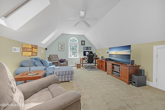 3878 White Blossom Cir, Southport, NC 28461 - living room featuring a skylight, light colored carpet, vaulted ceiling, a desk, and ceiling fan