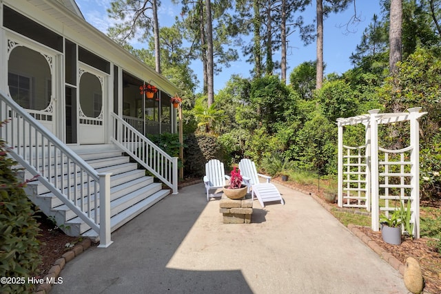 3878 White Blossom Cir, Southport, NC 28461 - view of patio with a sunroom and stairs