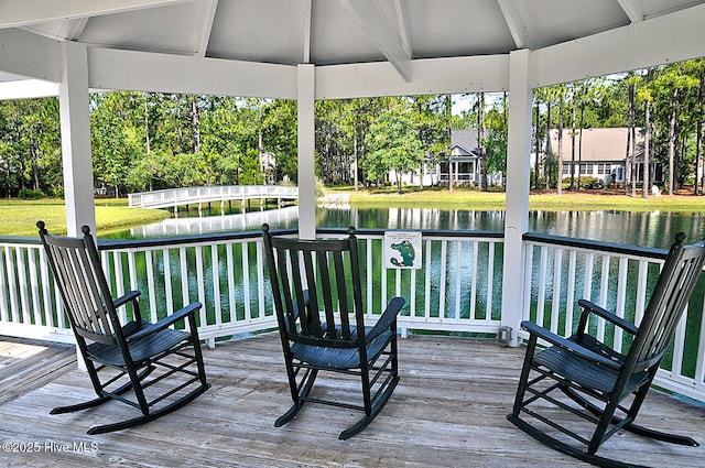 3878 White Blossom Cir, Southport, NC 28461 - wooden deck with a water view