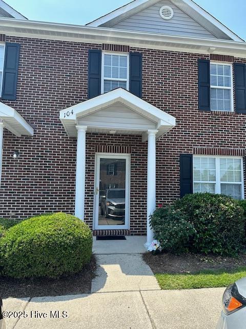 104 Lincoln Place Cir, Leland, NC 28451 - view of exterior entry featuring brick siding