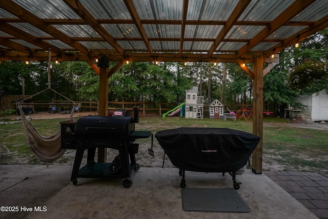 215 Chestwood Dr, Hubert, NC 28539 - fenced backyard with a playground, a patio, and a grill