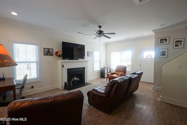 215 Chestwood Dr, Hubert, NC 28539 - living room featuring ornamental molding, baseboards, wood finished floors, healthy amount of natural light, and recessed lighting