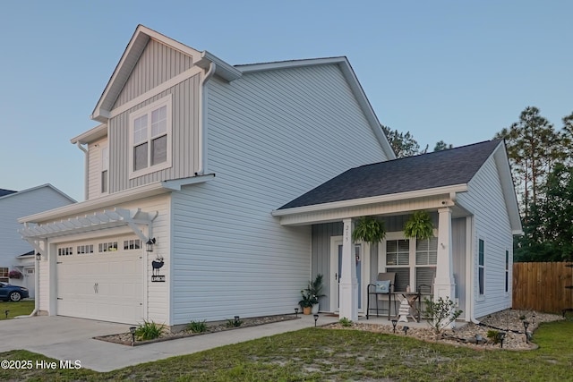 215 Chestwood Dr, Hubert, NC 28539 - view of front of home featuring an attached garage, a porch, and concrete driveway
