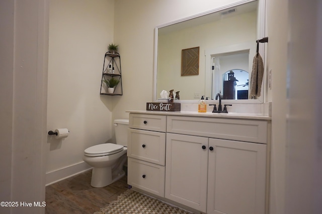 215 Chestwood Dr, Hubert, NC 28539 - half bath with toilet, vanity, wood finished floors, and baseboards