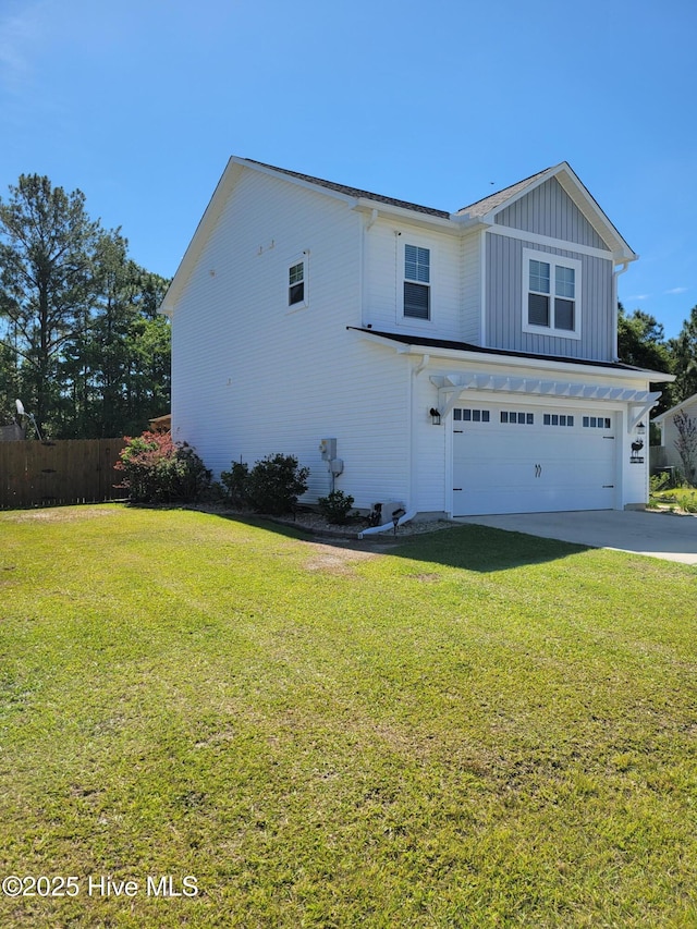 215 Chestwood Dr, Hubert, NC 28539 - view of home's exterior with a garage, board and batten siding, and driveway