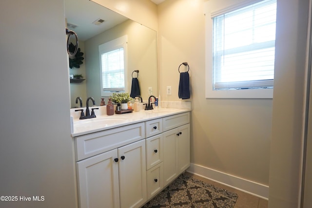 215 Chestwood Dr, Hubert, NC 28539 - bathroom featuring double vanity, tile patterned flooring, and baseboards