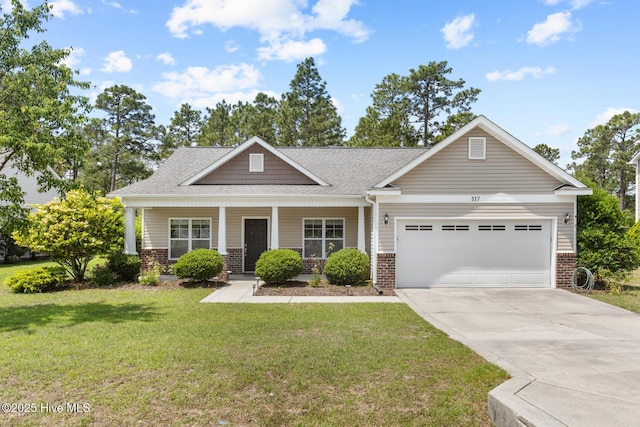 317 Inverness Dr, Hubert, NC 28539 - craftsman-style house featuring brick siding, driveway, a garage, a front yard, and a porch