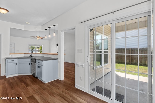 317 Inverness Dr, Hubert, NC 28539 - kitchen featuring dark wood-style flooring, dishwasher, a ceiling fan, pendant lighting, and a sink