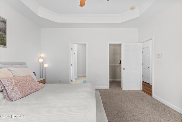 317 Inverness Dr, Hubert, NC 28539 - carpeted bedroom with a raised ceiling, a spacious closet, baseboards, a closet, and crown molding