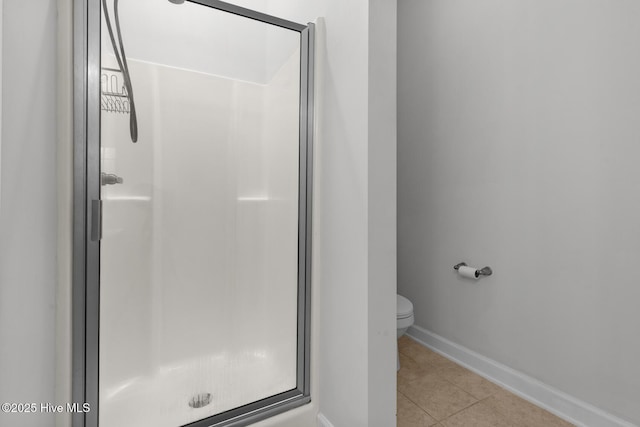 317 Inverness Dr, Hubert, NC 28539 - full bath featuring a shower stall, tile patterned flooring, toilet, and baseboards