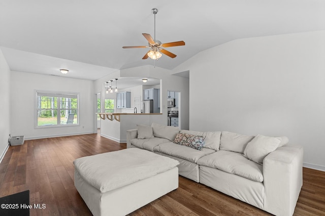 317 Inverness Dr, Hubert, NC 28539 - living area featuring a ceiling fan, baseboards, dark wood-style flooring, and vaulted ceiling
