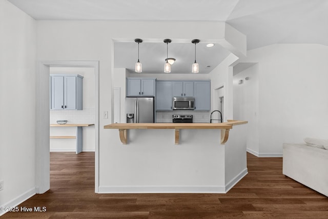 317 Inverness Dr, Hubert, NC 28539 - kitchen featuring appliances with stainless steel finishes, wooden counters, backsplash, and a breakfast bar