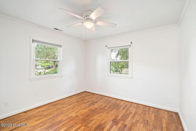 227 Rose Ave, Wilmington, NC 28403 - spare room featuring healthy amount of natural light, wood finished floors, ornamental molding, and ceiling fan