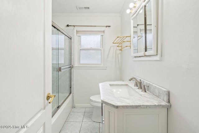 227 Rose Ave, Wilmington, NC 28403 - full bath with tile patterned floors, ornamental molding, combined bath / shower with glass door, and vanity