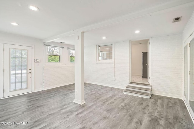 227 Rose Ave, Wilmington, NC 28403 - below grade area featuring brick wall, wood finished floors, and recessed lighting