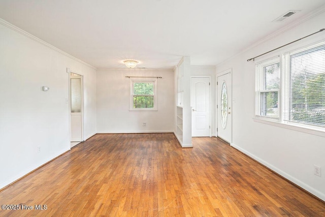 227 Rose Ave, Wilmington, NC 28403 - spare room featuring wood finished floors and ornamental molding