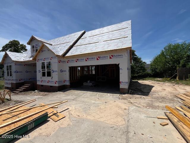 106 Camberly Ln, Aberdeen, NC 28315 - view of property exterior featuring driveway, crawl space, and a garage