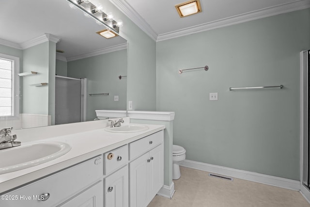 4710 Hudson Rd NW, Wilson, NC 27896 - bathroom featuring a shower stall, toilet, double vanity, ornamental molding, and baseboards