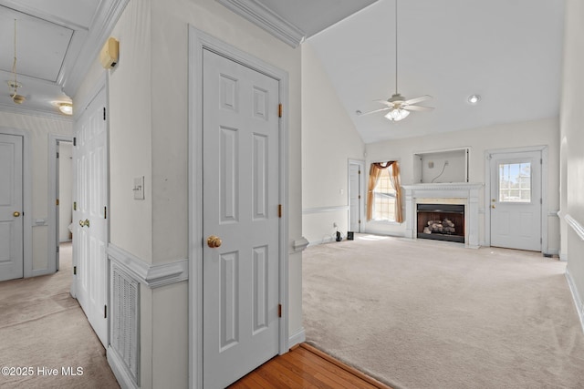 4710 Hudson Rd NW, Wilson, NC 27896 - corridor featuring attic access, light colored carpet, lofted ceiling, baseboards, and crown molding