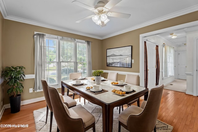 4710 Hudson Rd NW, Wilson, NC 27896 - dining room featuring light wood-style floors, crown molding, a ceiling fan, and baseboards