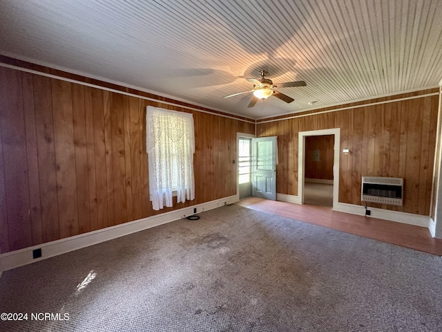 114 Rhodes Ave, Windsor, NC 27983 - unfurnished living room featuring heating unit, ceiling fan, wood walls, and carpet