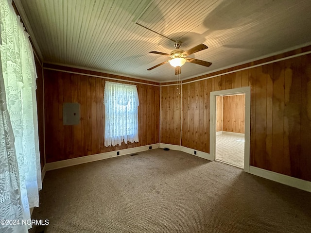 114 Rhodes Ave, Windsor, NC 27983 - carpeted spare room featuring ceiling fan, wooden walls, electric panel, baseboards, and wood ceiling