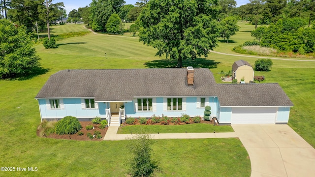 1235 Sound Shore Dr, Edenton, NC 27932 - view of front of property with an attached garage, driveway, a shingled roof, a front yard, and a chimney