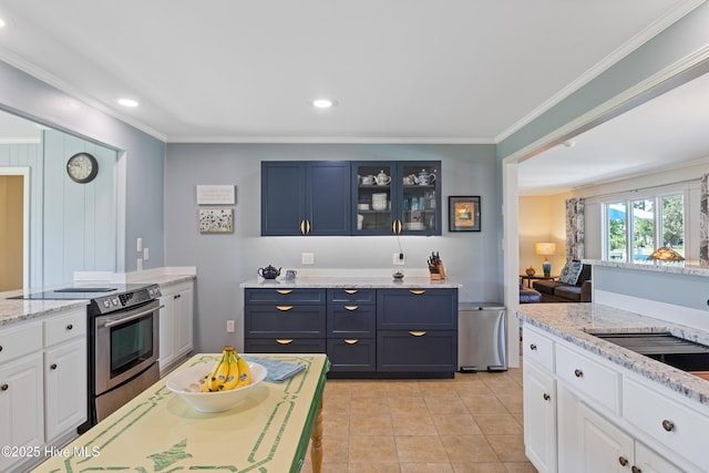 1235 Sound Shore Dr, Edenton, NC 27932 - kitchen with stainless steel electric range, ornamental molding, glass insert cabinets, light tile patterned flooring, and white cabinetry