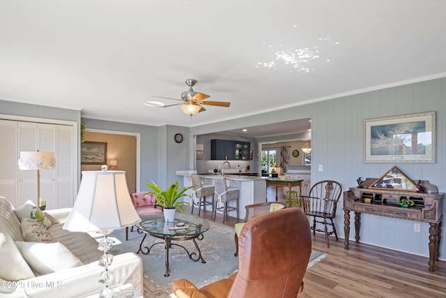 1235 Sound Shore Dr, Edenton, NC 27932 - living area with wood finished floors, ceiling fan, and crown molding