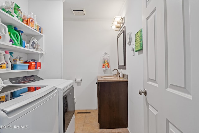 1235 Sound Shore Dr, Edenton, NC 27932 - laundry area with independent washer and dryer, light tile patterned floors, crown molding, and wet bar