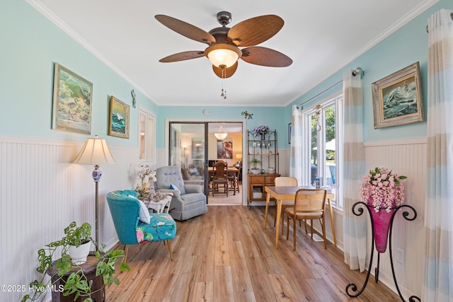 1235 Sound Shore Dr, Edenton, NC 27932 - living area featuring light wood finished floors, a wainscoted wall, ceiling fan, and ornamental molding