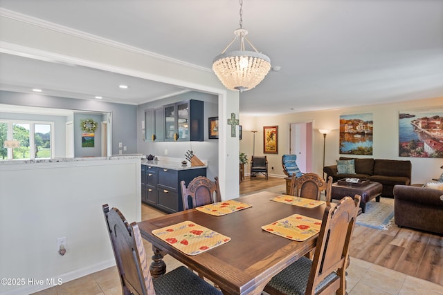 1235 Sound Shore Dr, Edenton, NC 27932 - dining area featuring light tile patterned floors, a chandelier, crown molding, and recessed lighting