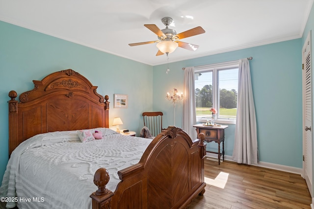 1235 Sound Shore Dr, Edenton, NC 27932 - bedroom featuring wood finished floors, baseboards, crown molding, and ceiling fan