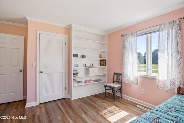 1235 Sound Shore Dr, Edenton, NC 27932 - bedroom featuring wood finished floors, crown molding, and baseboards