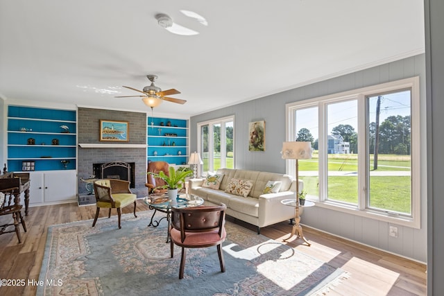 1235 Sound Shore Dr, Edenton, NC 27932 - living area with plenty of natural light, wood finished floors, built in features, and crown molding