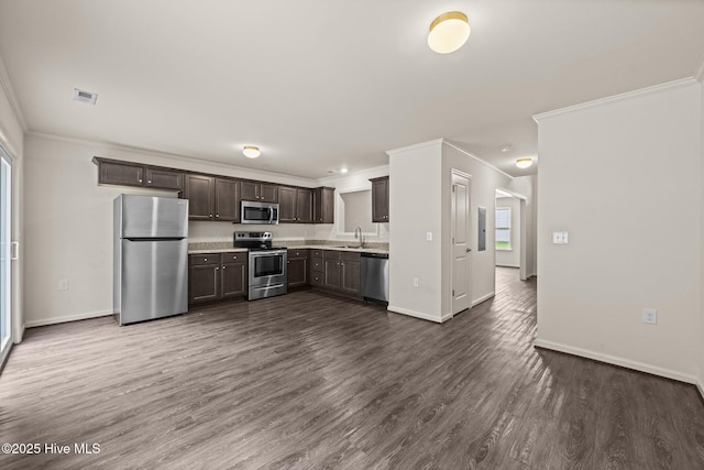 312 Glenellen Loop Rd, Midway Park, NC 28544 - kitchen featuring stainless steel appliances, crown molding, dark brown cabinetry, baseboards, and dark wood-style flooring