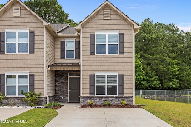 312 Glenellen Loop Rd, Midway Park, NC 28544 - view of front of house featuring stone siding, a standing seam roof, metal roof, and a shingled roof