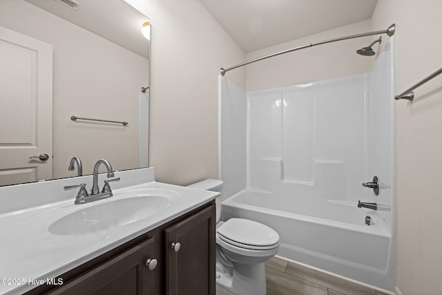 312 Glenellen Loop Rd, Midway Park, NC 28544 - full bathroom with vanity, toilet, washtub / shower combination, and wood finished floors