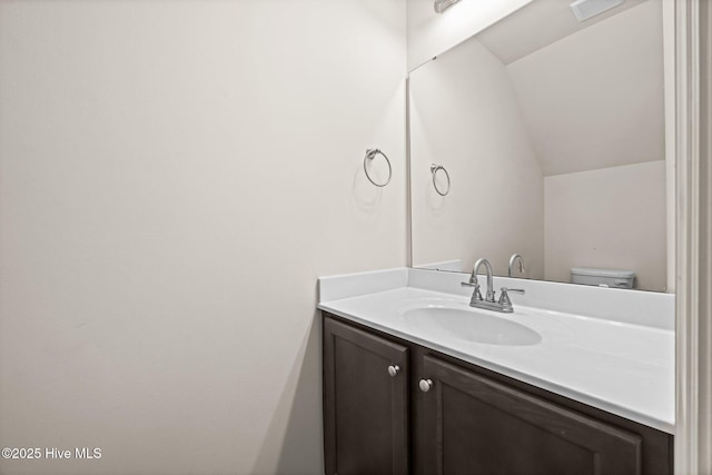 312 Glenellen Loop Rd, Midway Park, NC 28544 - half bath featuring vanity, lofted ceiling, and toilet
