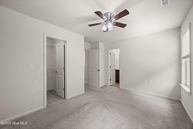 312 Glenellen Loop Rd, Midway Park, NC 28544 - unfurnished bedroom with a walk in closet, carpet, and baseboards