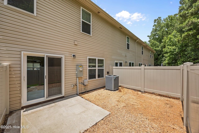 312 Glenellen Loop Rd, Midway Park, NC 28544 - rear view of house with cooling unit and a patio