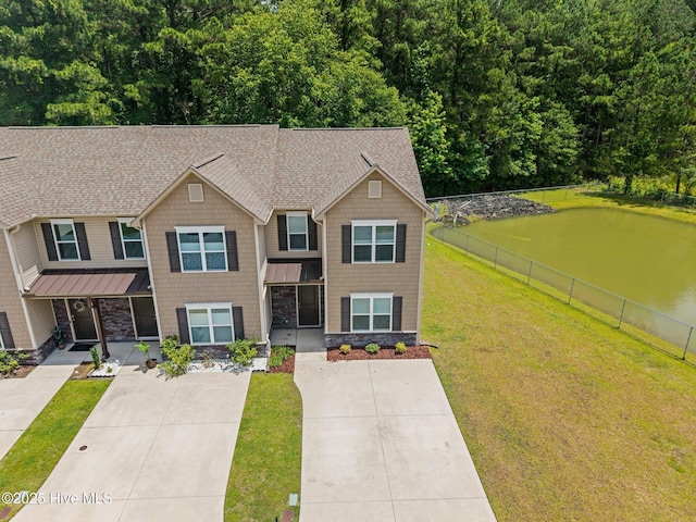 312 Glenellen Loop Rd, Midway Park, NC 28544 - view of front of house with a shingled roof, a water view, and a standing seam roof