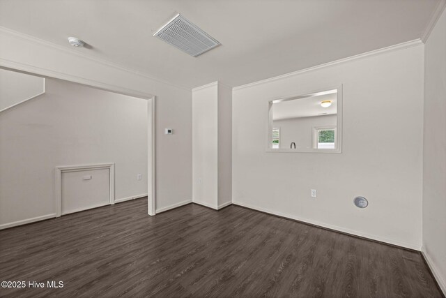 312 Glenellen Loop Rd, Midway Park, NC 28544 - unfurnished room featuring dark wood-style flooring, a smoke detector, ornamental molding, and baseboards