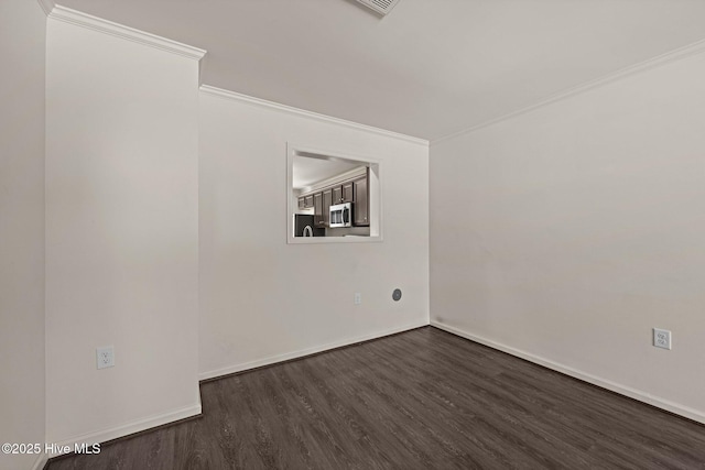 312 Glenellen Loop Rd, Midway Park, NC 28544 - empty room featuring dark wood-style flooring, ornamental molding, and baseboards
