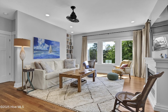 1246 Heron Run Dr, Wilmington, NC 28403 - living area featuring wood finished floors, recessed lighting, a fireplace, and baseboards