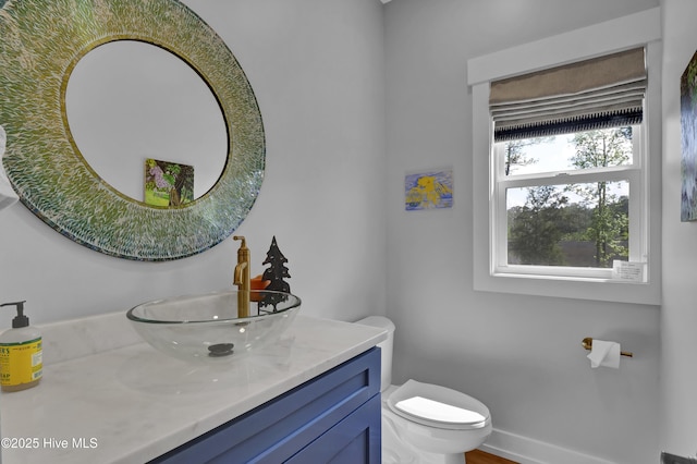 1246 Heron Run Dr, Wilmington, NC 28403 - bathroom featuring vanity, toilet, and baseboards