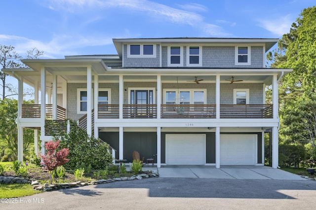 1246 Heron Run Dr, Wilmington, NC 28403 - view of front of property featuring driveway, an attached garage, and a ceiling fan