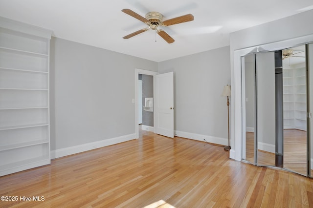 1206 Lancaster Ln, Rockingham, NC 28379 - unfurnished bedroom featuring light wood-type flooring, a closet, baseboards, and ceiling fan