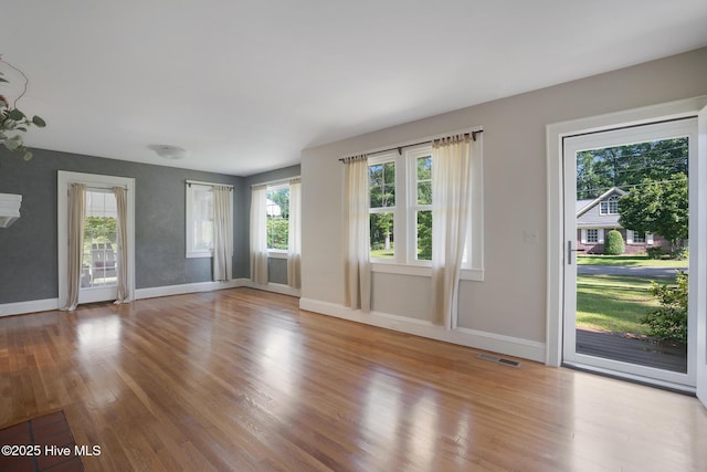 1206 Lancaster Ln, Rockingham, NC 28379 - unfurnished living room with wood finished floors and baseboards